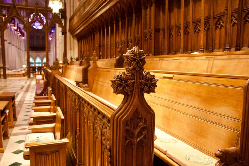 Ornate wooden benches in cathedral