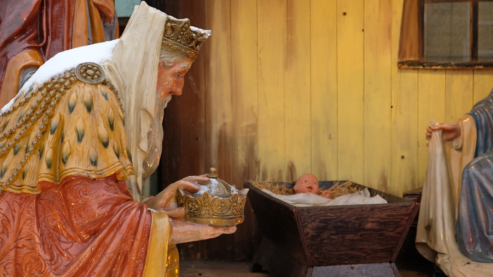 Nativity scene with baby Jesus. The Magi in the nativity scene. Three Kings visited Jesus